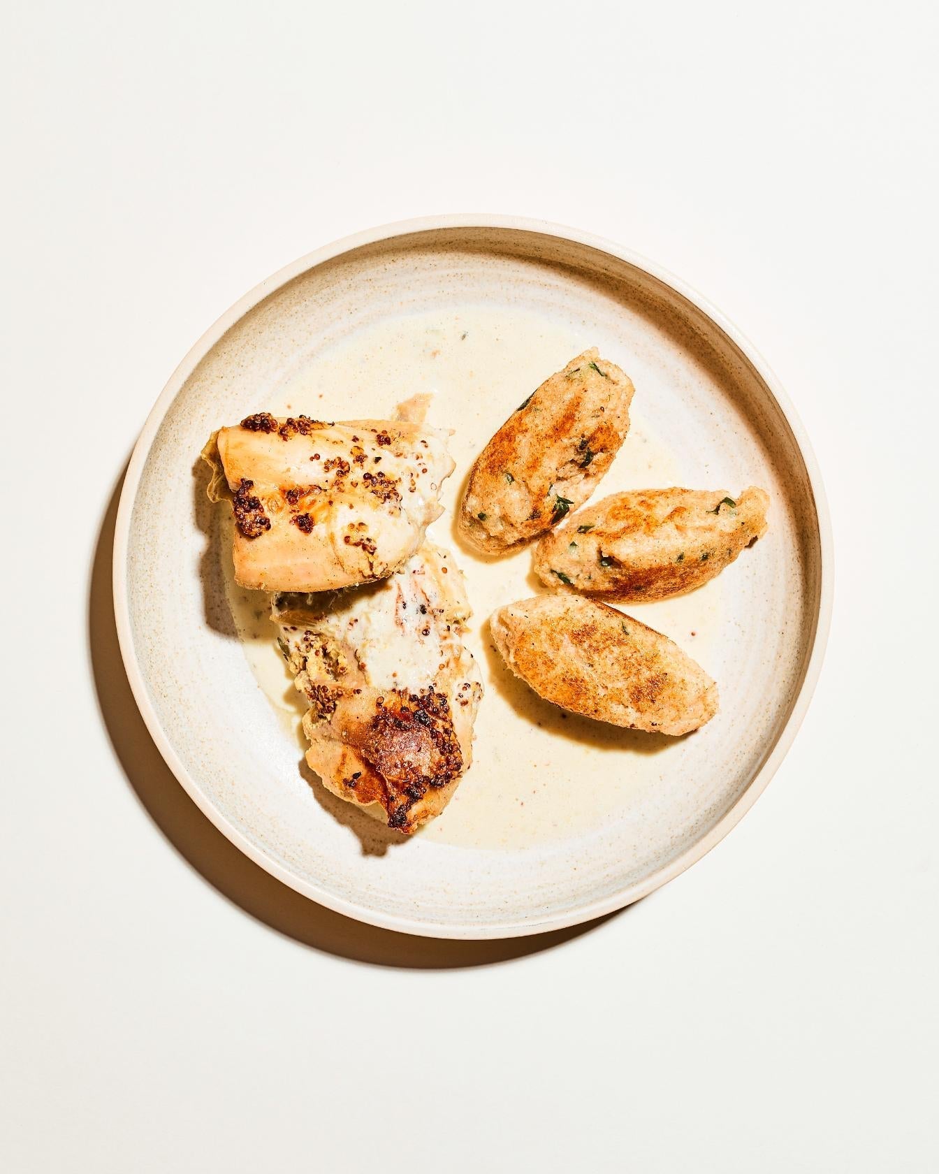 Cosce di coniglio con salsa alla senape e gnocchi di semolino
